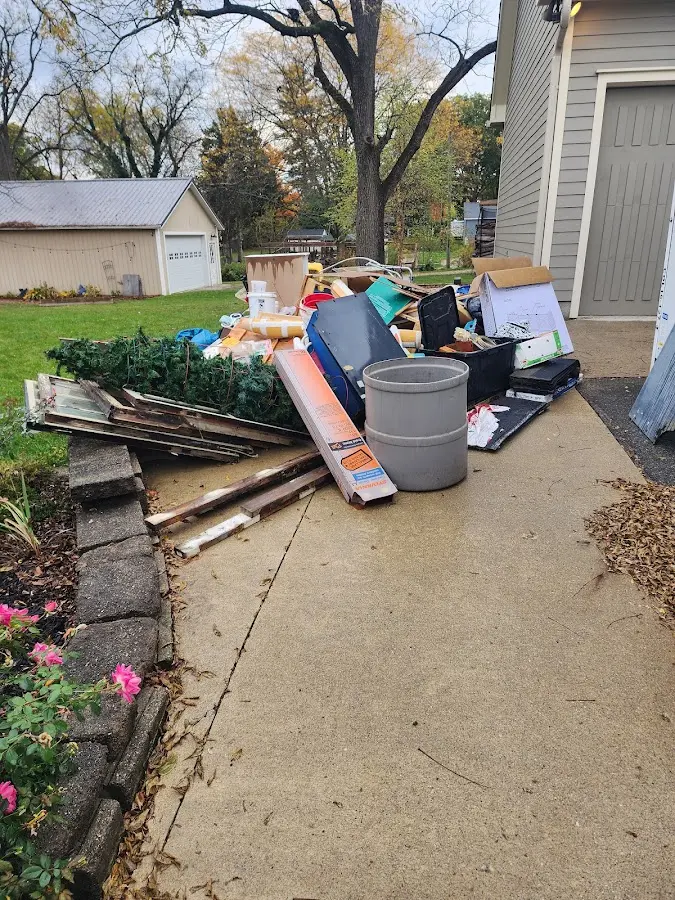 Dumpster being loaded with debris for Commercial Dumpster Rental in Slaughterville
